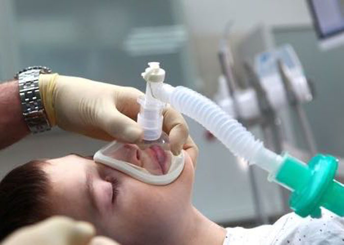 Child receiving anesthesia in hospital.