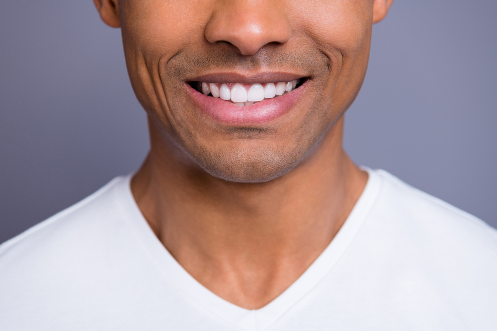 Smiling person showing white teeth